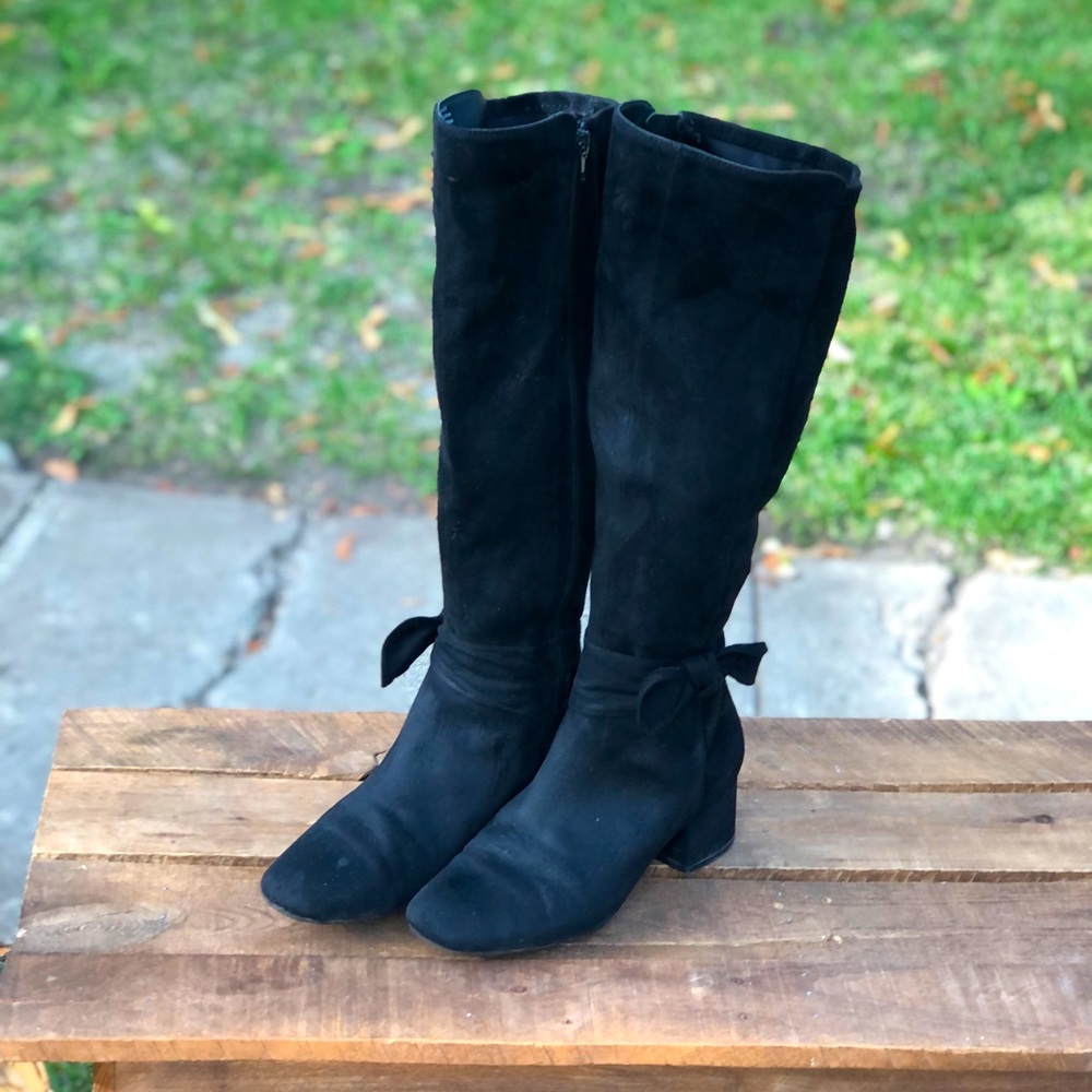 Onalee high heeled black zip boots with bow